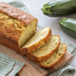 Classic Zucchini Bread sliced on a cutting board