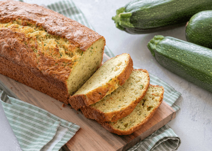 Classic Zucchini Bread sliced on a cutting board