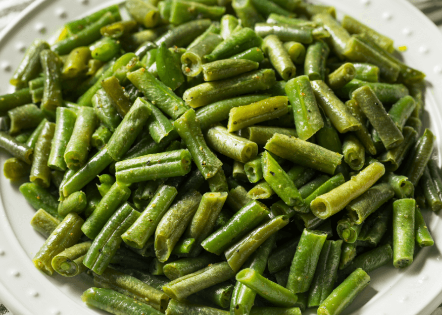 Sautéed Dutch Green Beans in a white bowl.