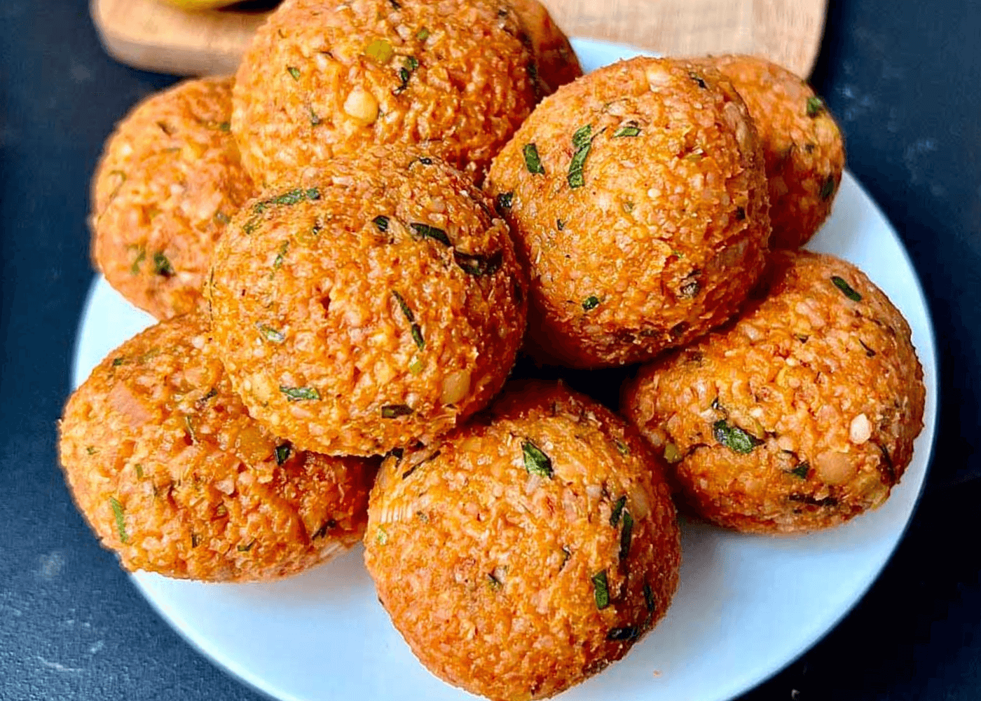 Lentil Meatballs stacked on a white plate