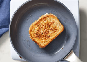 Blackberry Jam and Brie Cheese Sandwich cooking on a skillet