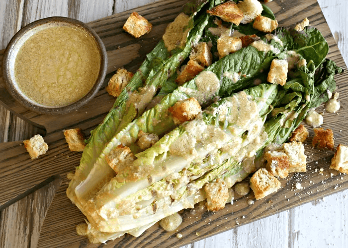 Grilled Caesar Salad on a wood cutting board