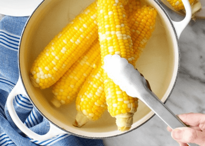corn on the cob in a large pot of water