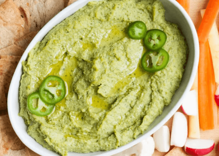 Avocado Hummus with jalapenos served with veggies and crackers
