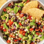 Cowboy Caviar with corn, avocado, beans, onions, peppers