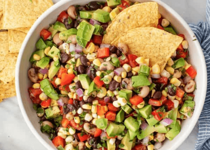 Cowboy Caviar with corn, avocado, beans, onions, peppers