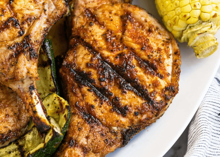 Grilled Pork Chops with zucchini and corn on the cob