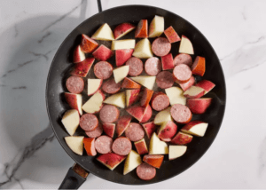 Diced Kielbasa and potatoes in a skillet