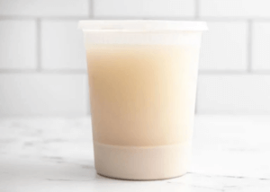 Oat milk in a closed plastic container