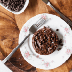 Vegan Single Serving Brownie on a white plate on a cutting board