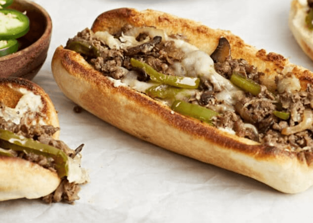 Philly Cheesesteak Sandwiches with peppers, onions, and shredded steak