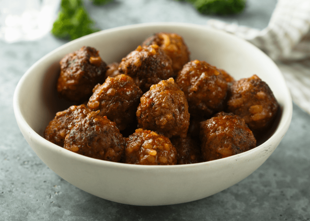 Bison Meatballs stacked in a white bowl