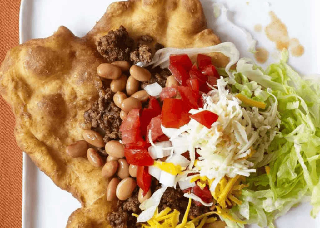 Fry Bread with beef, beans, cheese, tomatoes, onions, and lettuce