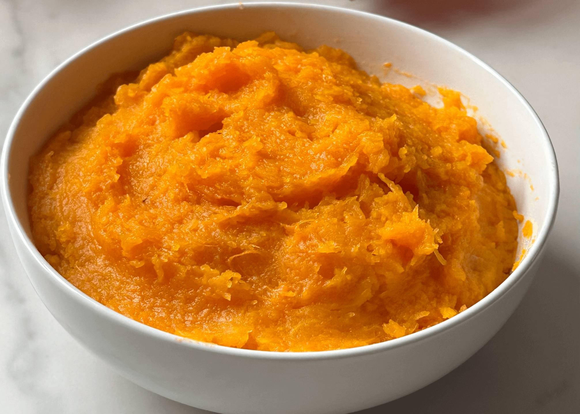 Butternut Squash Puree in a white bowl