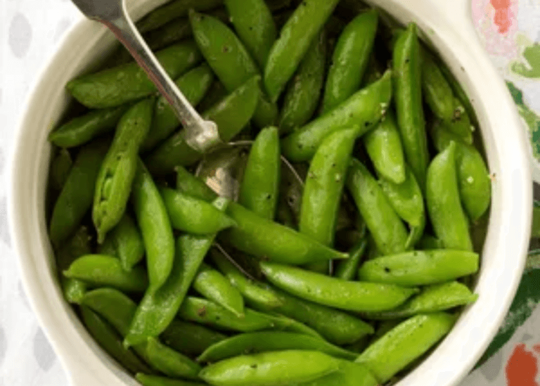 Zesty Sugar Snap Peas in a white bowl