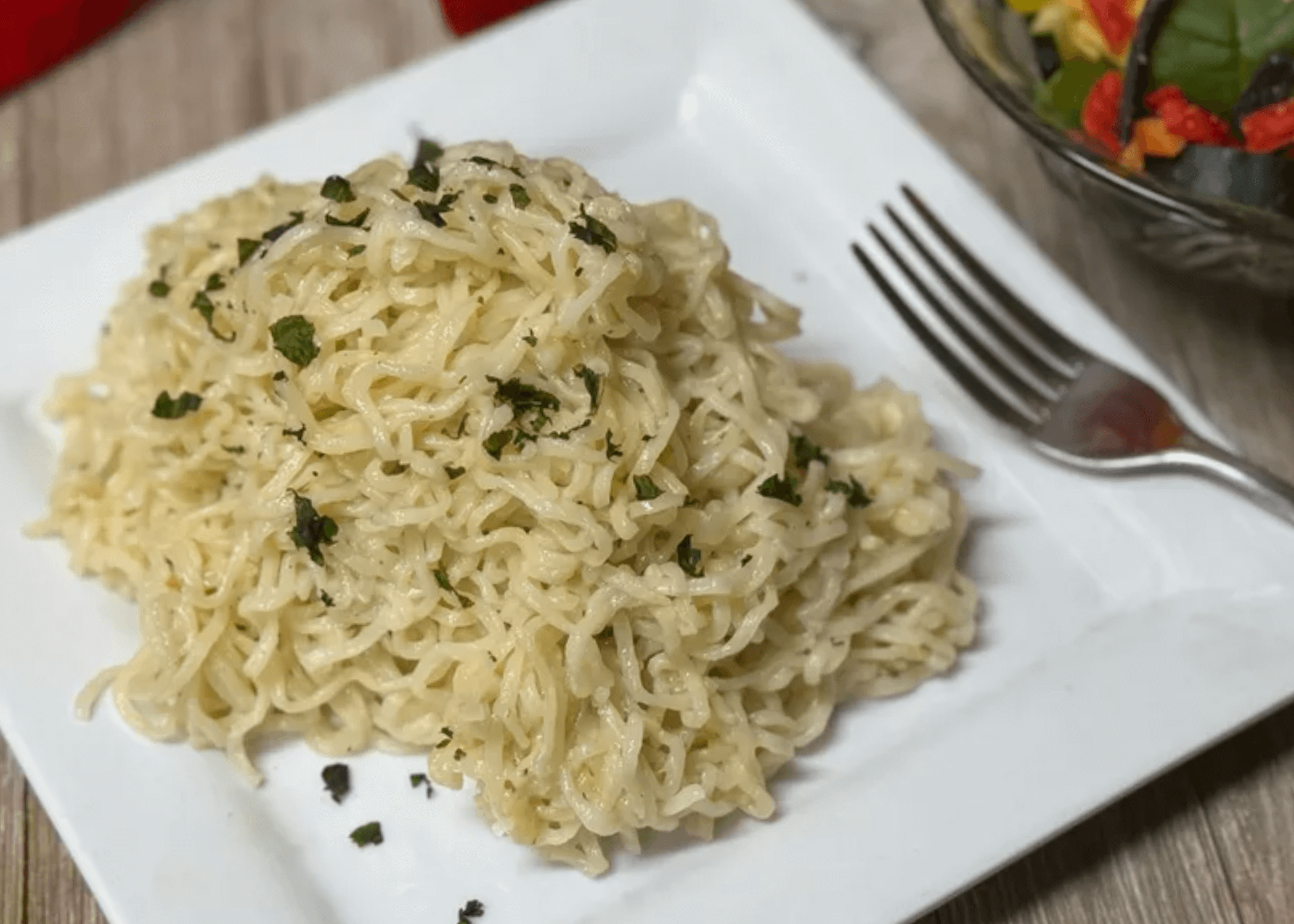 Parmesan Garlic Ramen noodles on a white plate