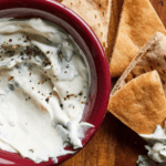 Tahini-Yogurt Dip in a bowl with pita slices