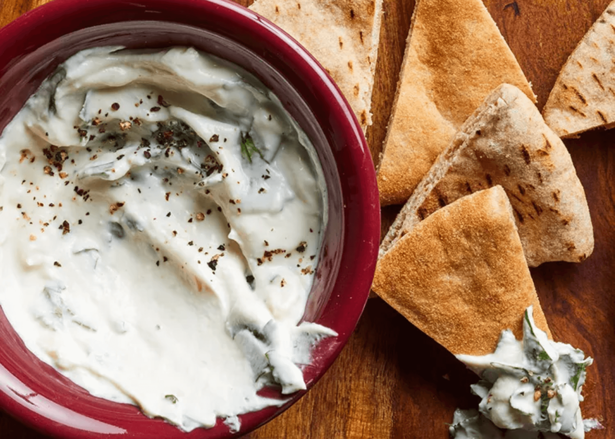 Tahini-Yogurt Dip in a bowl with pita slices