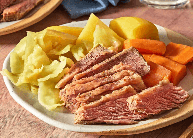 Corned beef, cabbage, potatoes, and carrots on a plate